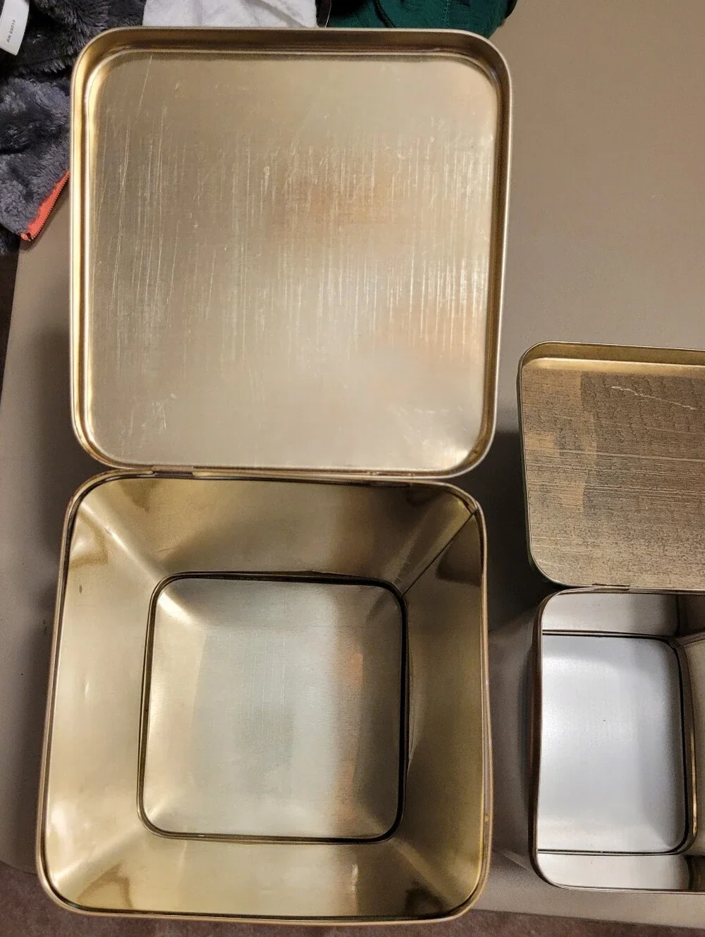 LASLO - Set of 3 Nesting Tan Metal Canisters with Green Lids and Stripes.
